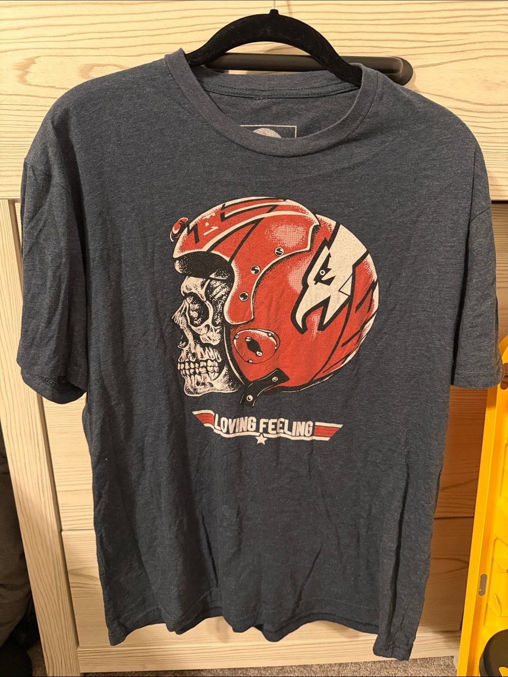 Vintage-Inspired Navy Blue Short Sleeve Tee with Red Helmet Graphic